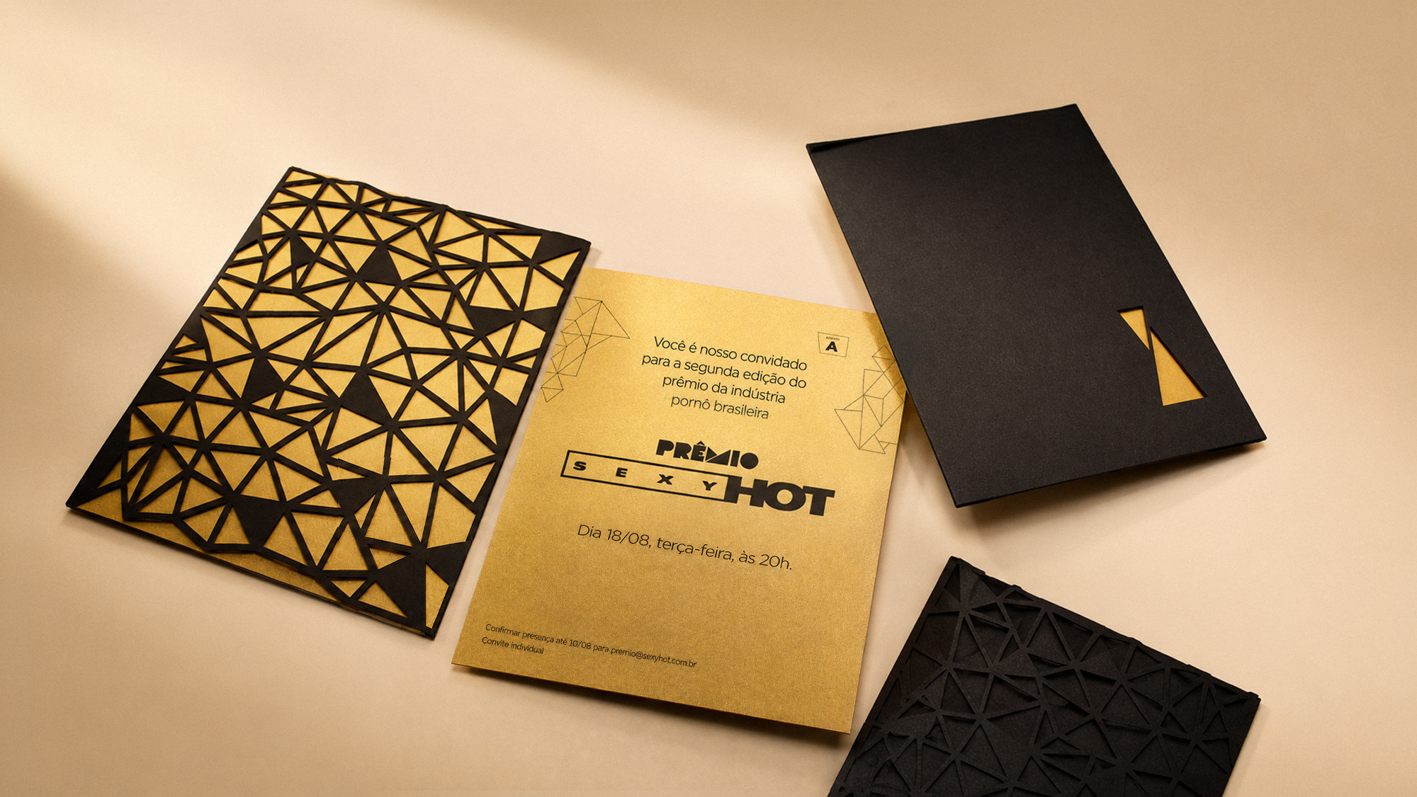 Laser-cut invitation in black and gold